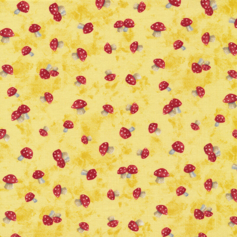 This fabric features tossed red and white mushrooms on a bright yellow mottled background.