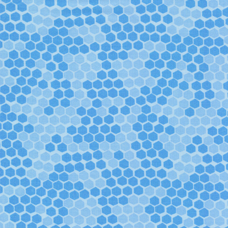 This fabric features a tonal blue honeycomb print