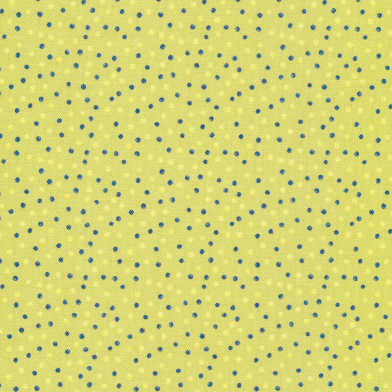 This fabric features dark blue and bright yellow watercolor dots on a lime green background.