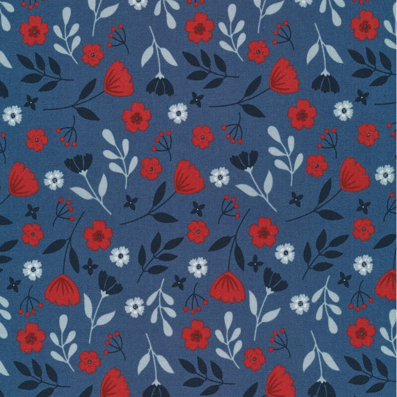 navy fabric featuring tossed flowers and sprigs of leaves in midnight blue, bright red, and gray blue