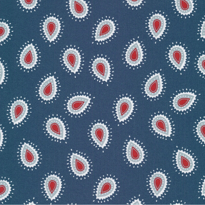 navy fabric featuring abstract droplet shapes in gray blue, bright red, and soft white