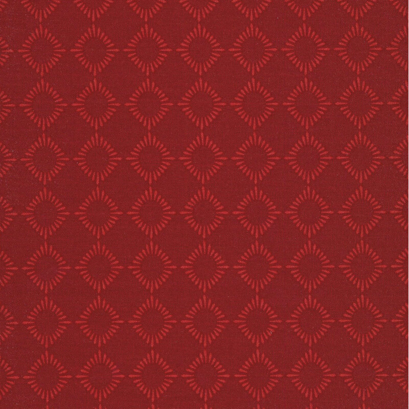 tonal red fabric featuring geometric diamond shapes