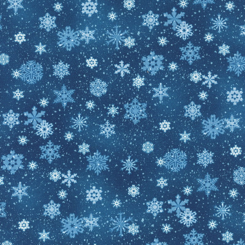 Blue mottled fabric with various snowflakes all over it