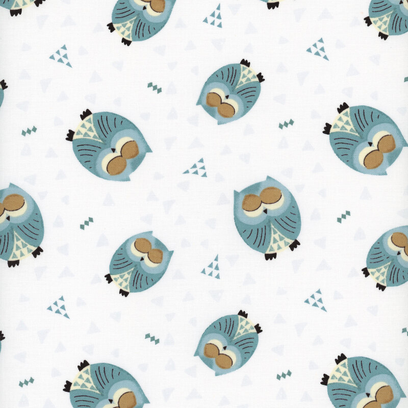 This fabric features tossed sleepy blue owls on a solid white background with blue and light gray triangles.