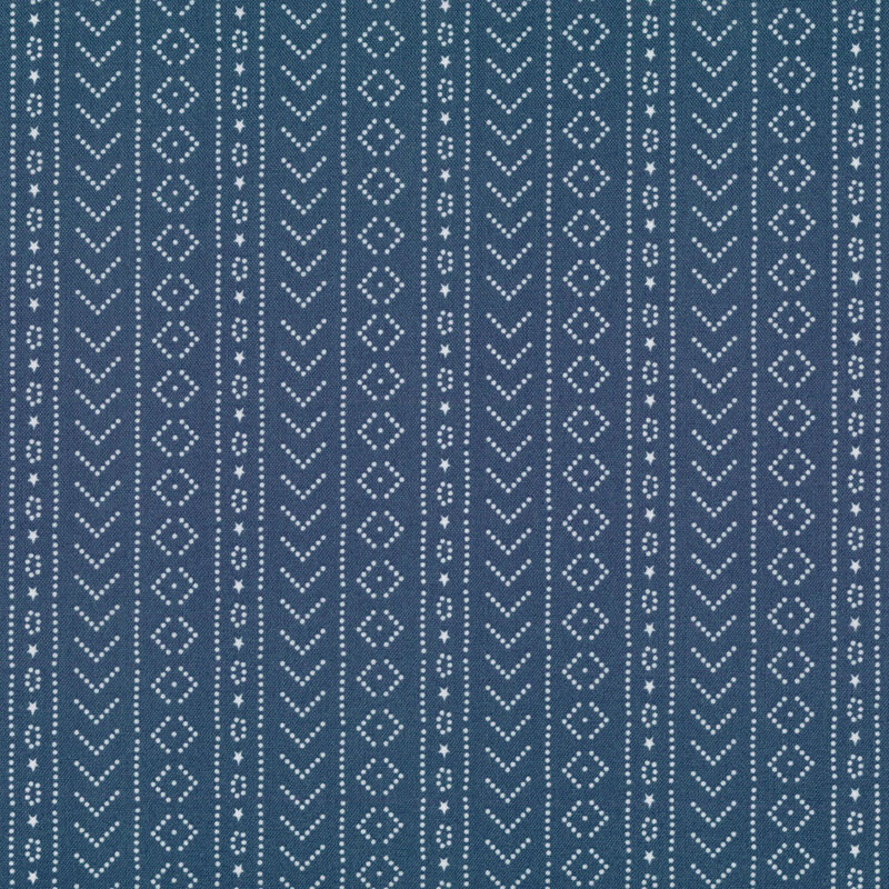 navy fabric featuring white dots arranged in geometric shapes 