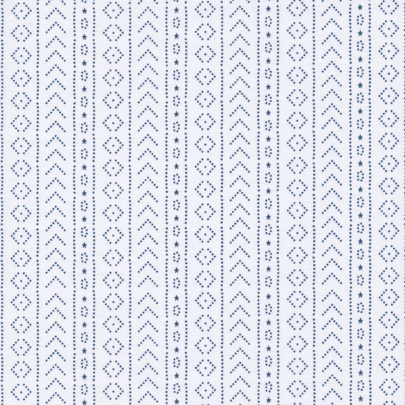 white fabric featuring midnight blue dots arranged in geometric shapes and stripes, and tiny stars
