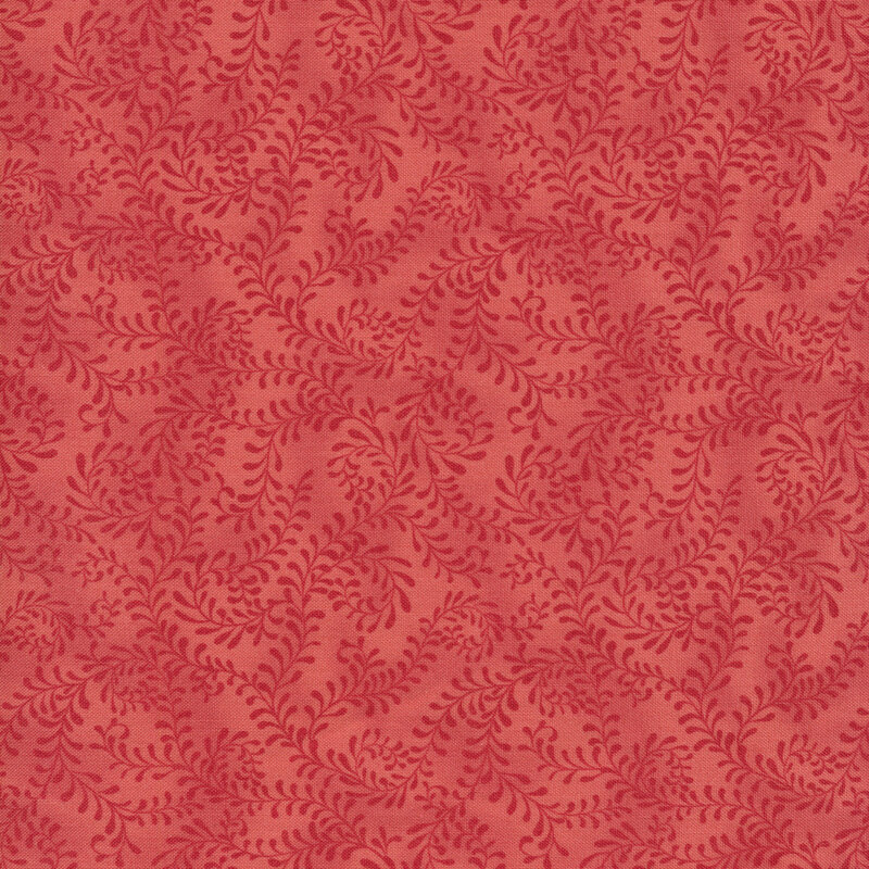 This fabric features a bright pink pattern of swirling leafy vines on a mottled rosy pink background.