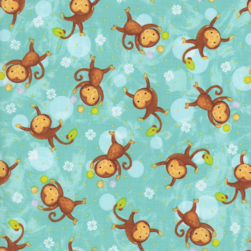 fabric featuring monkeys tossed on a turquoise background with white scalloped flower-like motifs