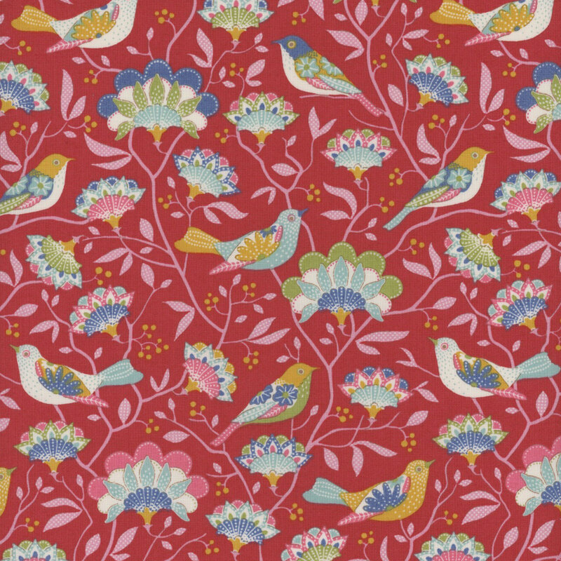 This fabric features light pink branches with colorful mutlicolored flowers and intricate multicolored birds on a bold red background.