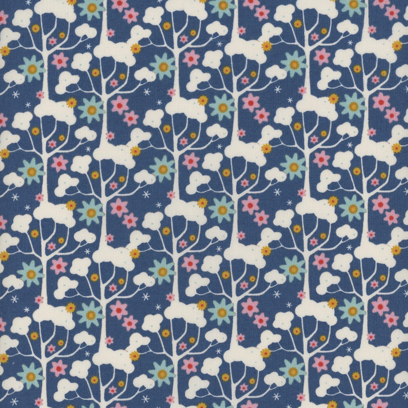 This fabric features cream tree branches with ditsy light blue, golden yellow and light pink flowers on a bright blue background.