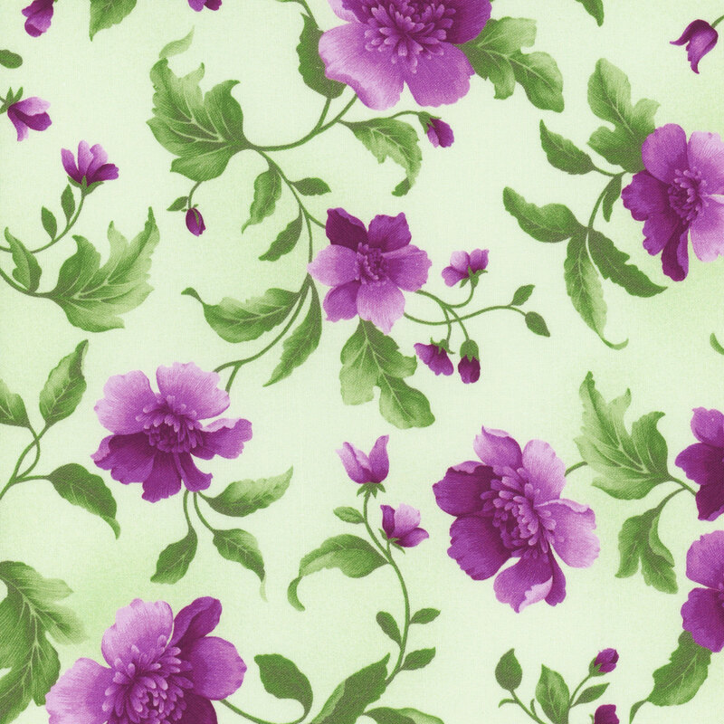 This fabric features purple flowers on bright green vines on a lightly mottled green background.