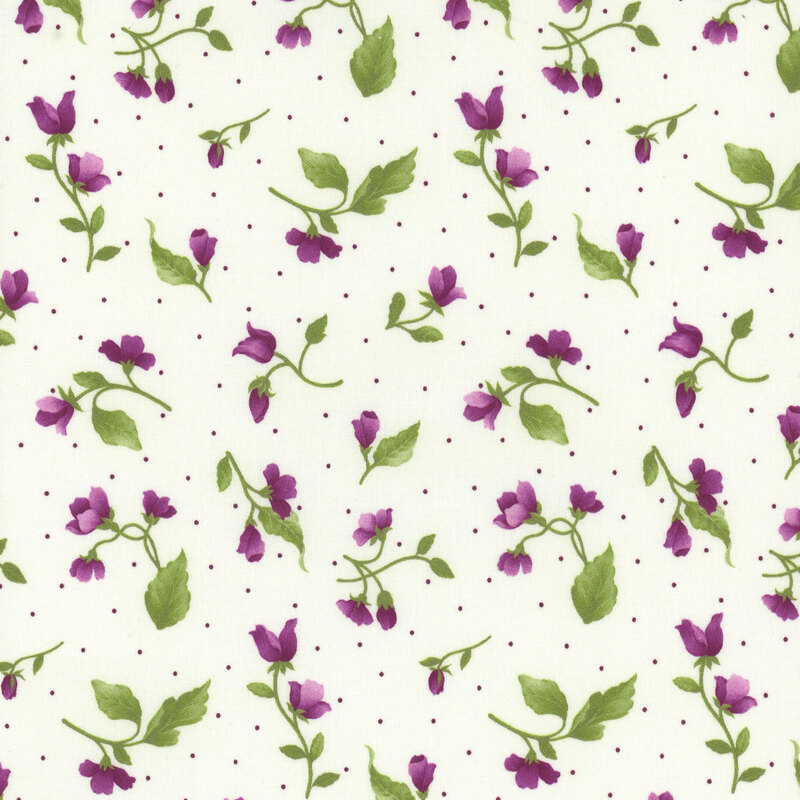 This fabric features tossed purple flower buds and pin dots on a solid cream background.