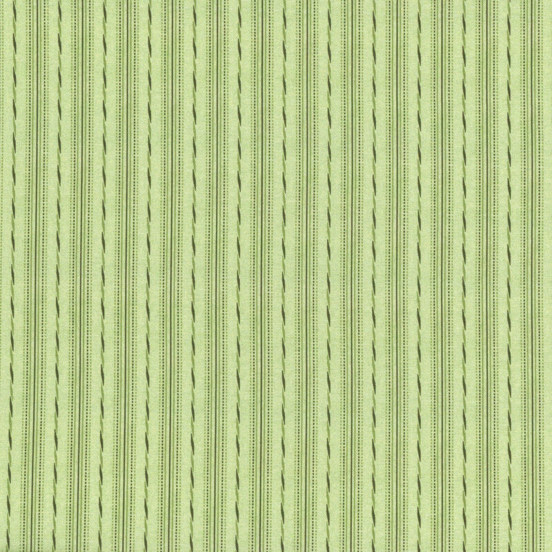 This fabric features green tonal stripes and dashes stripes on a green background.