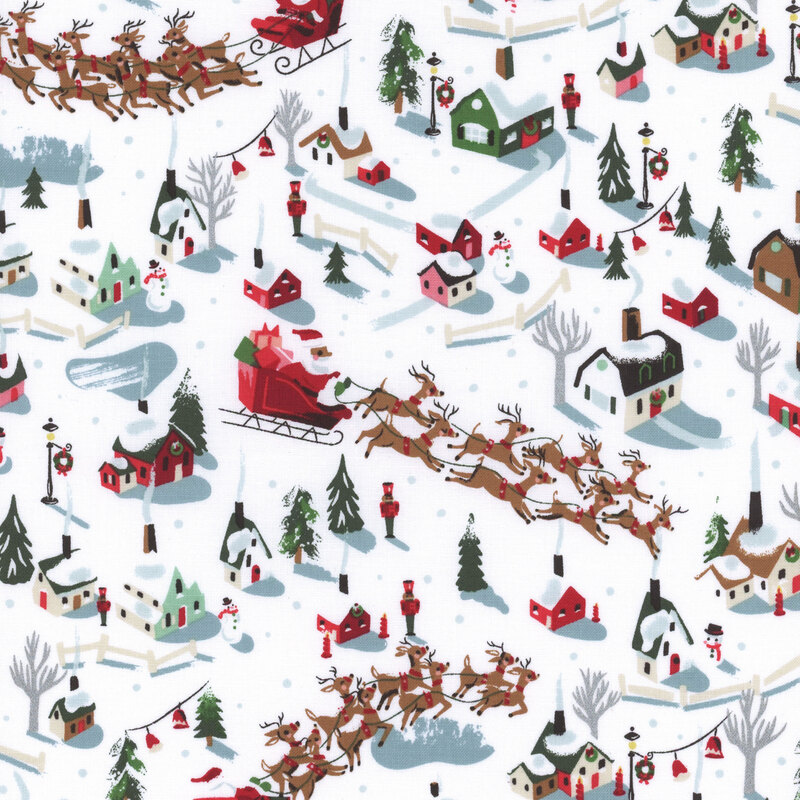 fabric featuring red, green and white houses with Santa and his reindeer soaring above on a white background.
