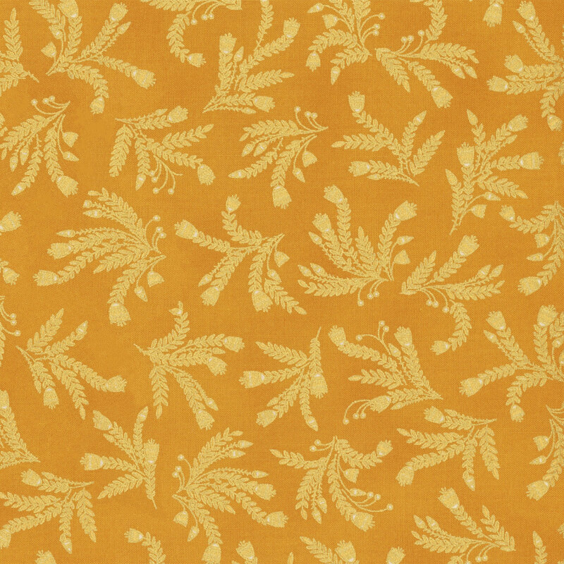This fabric features bunches of gold metallic vines on a golden yellow background.