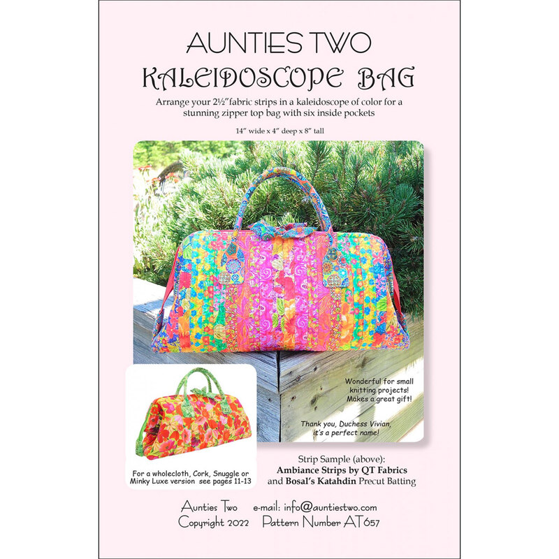 The front of the Kaleidoscope Bag Pattern by Aunties Two showing a colorful tote bag in front of shrubs