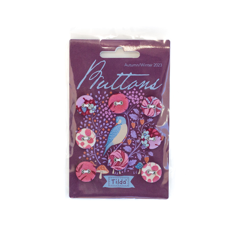 Package of buttons with purple and magenta fabric in a package with purple and blue birds