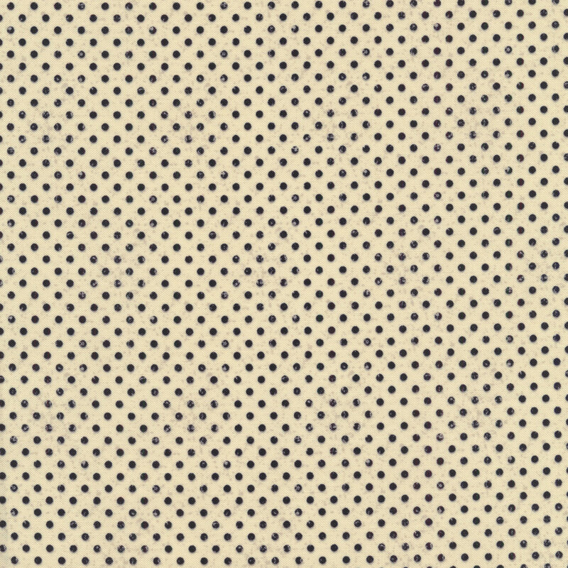 Fabric swatch with small black polka dots all over a beige background