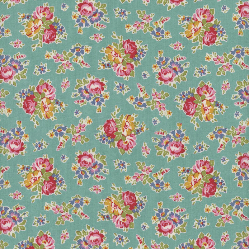 This fabric features clusters of pink, blue and yellow flowers on an aqua teal background.