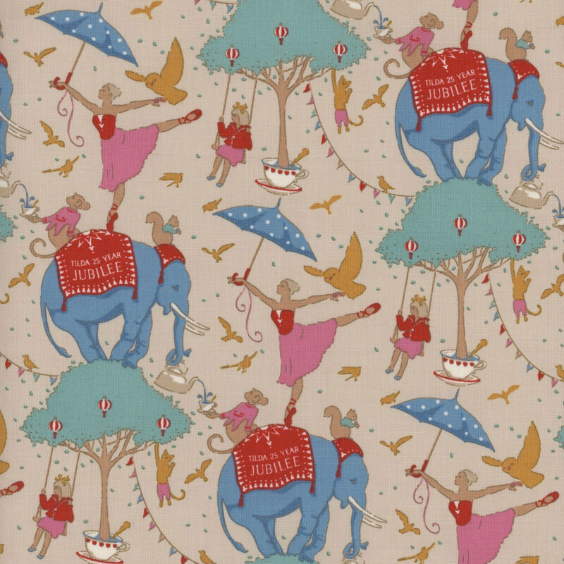 This fabric features animals and ballerinas standing on an elephant, which stands on an aqua and tan tree with a creme background.