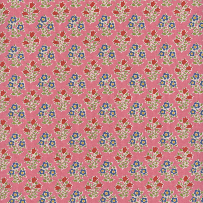 This fabric features a repeating print of blue flowers with yellow centers and red flowers, both with bright green leaves on a lovely pink background.