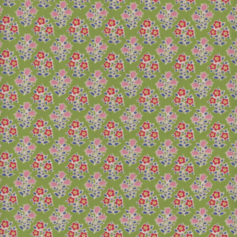 This fabric features a repeating print of red flowers with yellow centers and pink flowers, both with dark blue leaves on a bright green background.