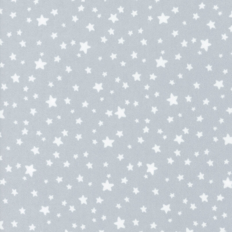 flannel fabric featuring adorable ditsy tossed white stars on a light gray background