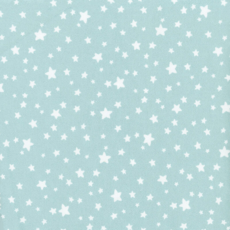 flannel fabric featuring adorable ditsy tossed white stars on a dusty aqua blue background
