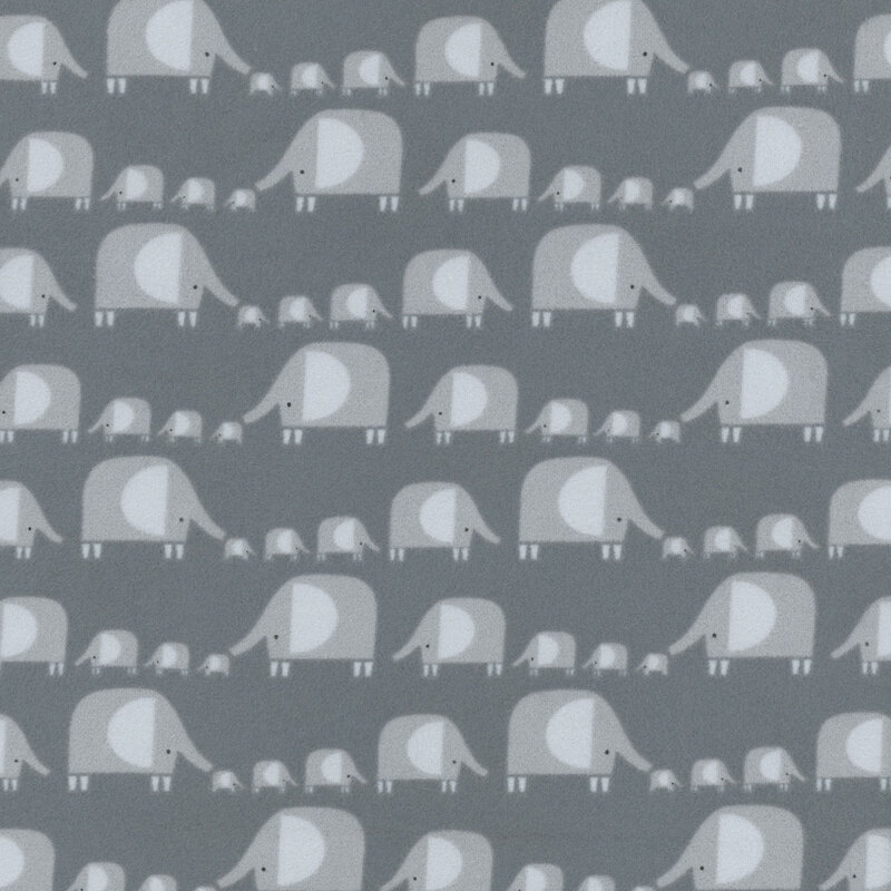 fabric featuring rows and rows of gray elephants in varying sizes in stylized geometric shapes on a dark solid gray background.