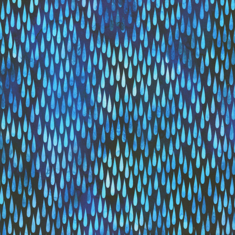 This fabric features bright mottled blue raindrops on a dark blue mottled background.