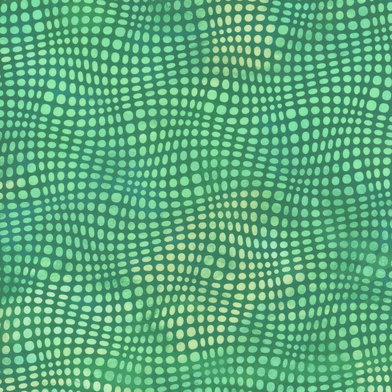 This fabric features light mint wavy dots on a darker mint green mottled background.