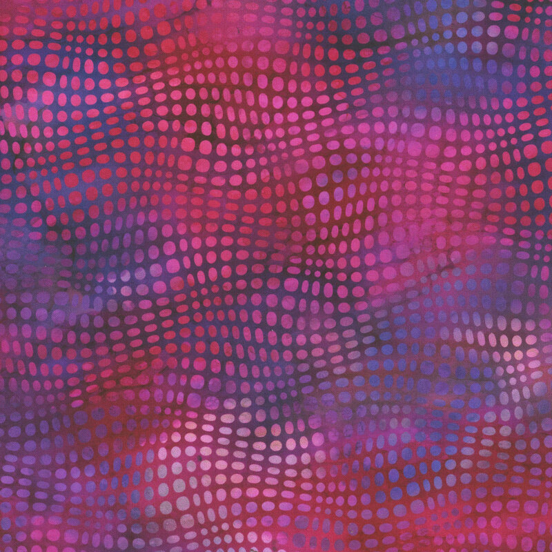 This fabric features pink and magenta wavy dots on a purple and blue mottled background.