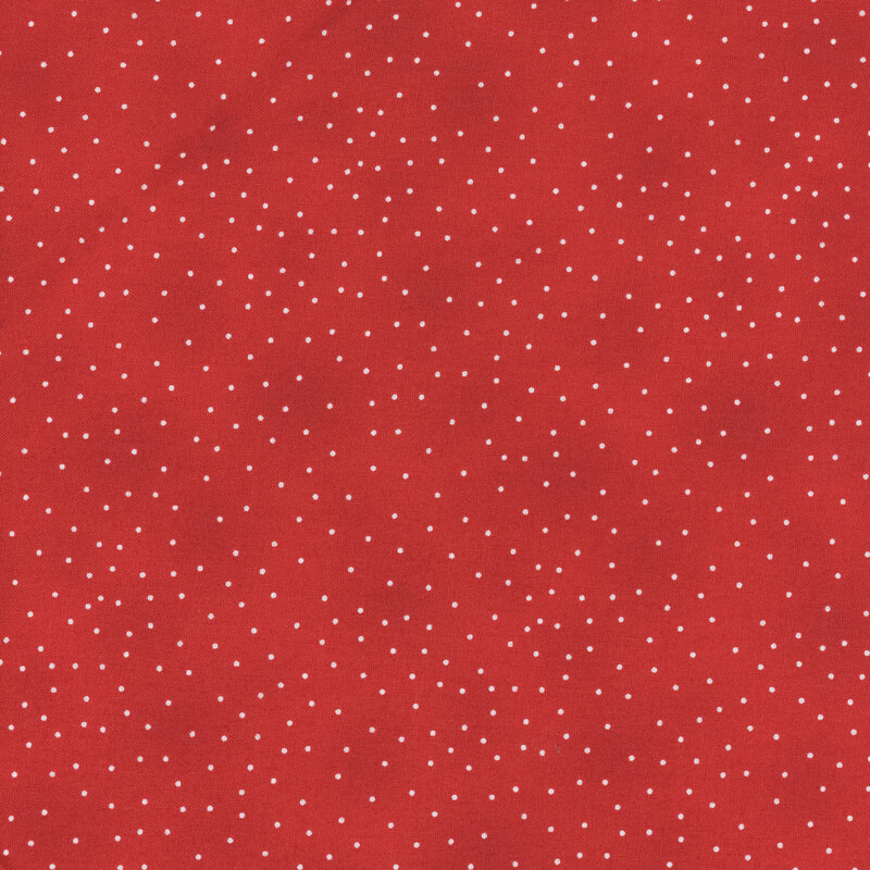 bright red fabric with small white polka dots all over