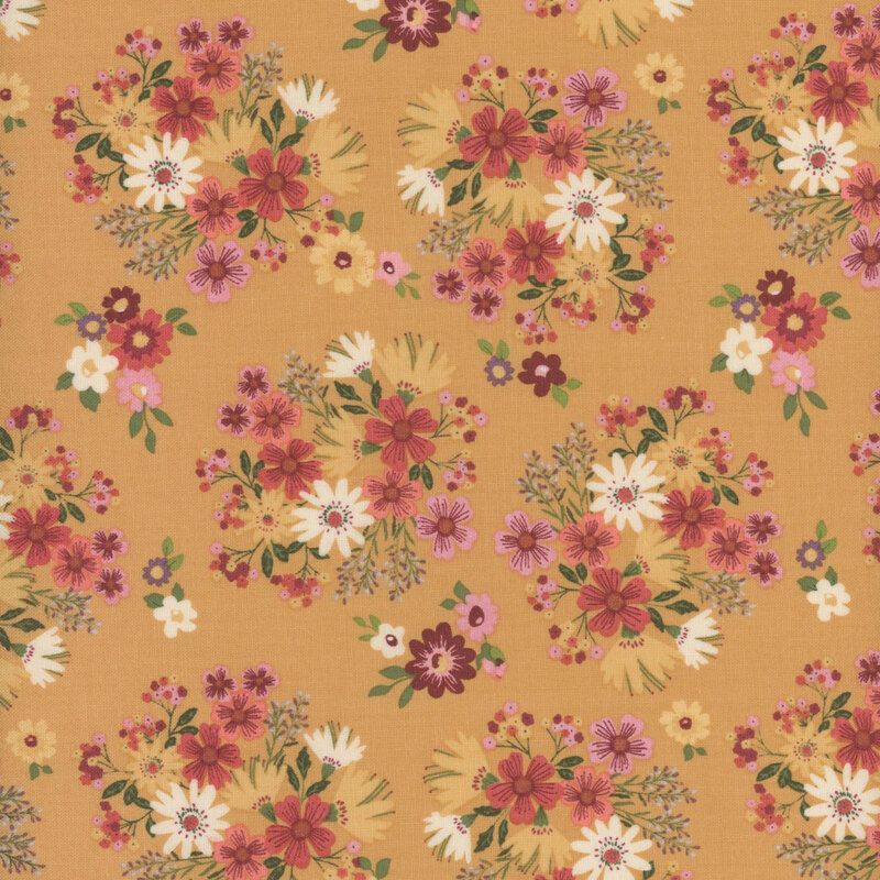 fabric featuring adorable clusters of burnt red, pink, yellow and cream flowers with sage green leaves on a solid golden yellow background.