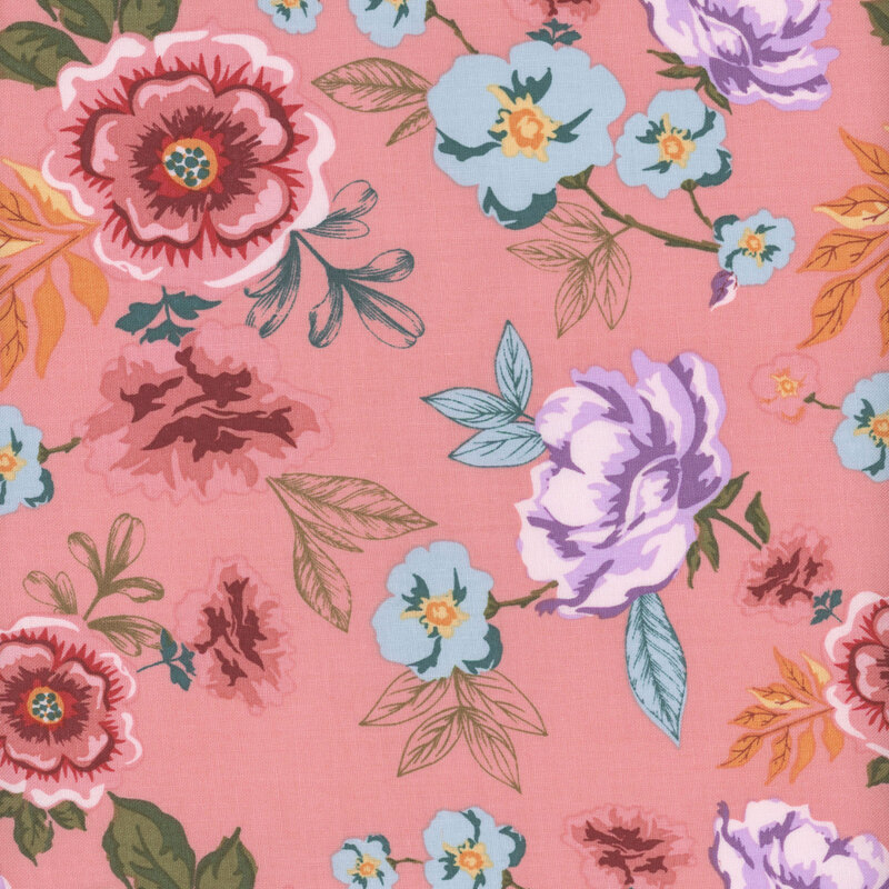 fabric featuring large rosy pink flowers, blue blossoms and colorful green, teal and yellow leaves on a light rosy pink background.