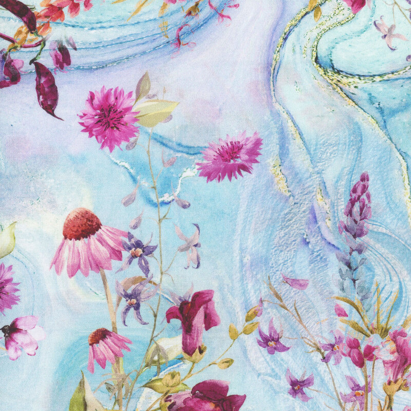 fabric featuring various types of purple blooming flowers on a marbled blue, aqua, light purple and golden yellow background.