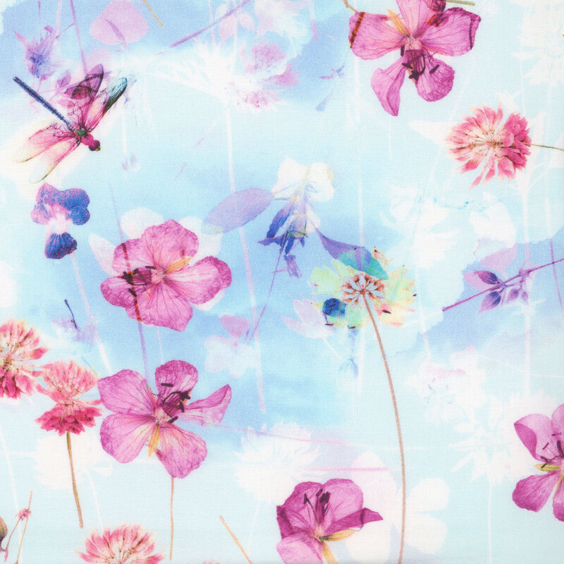fabric with tossed magenta flowers and flower stems on a white and light sky blue mottled background.