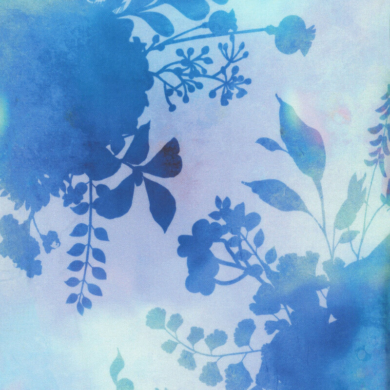 fabric featuring dark blue flower and foliage silhouettes on a mottled sky blue and light purple background.