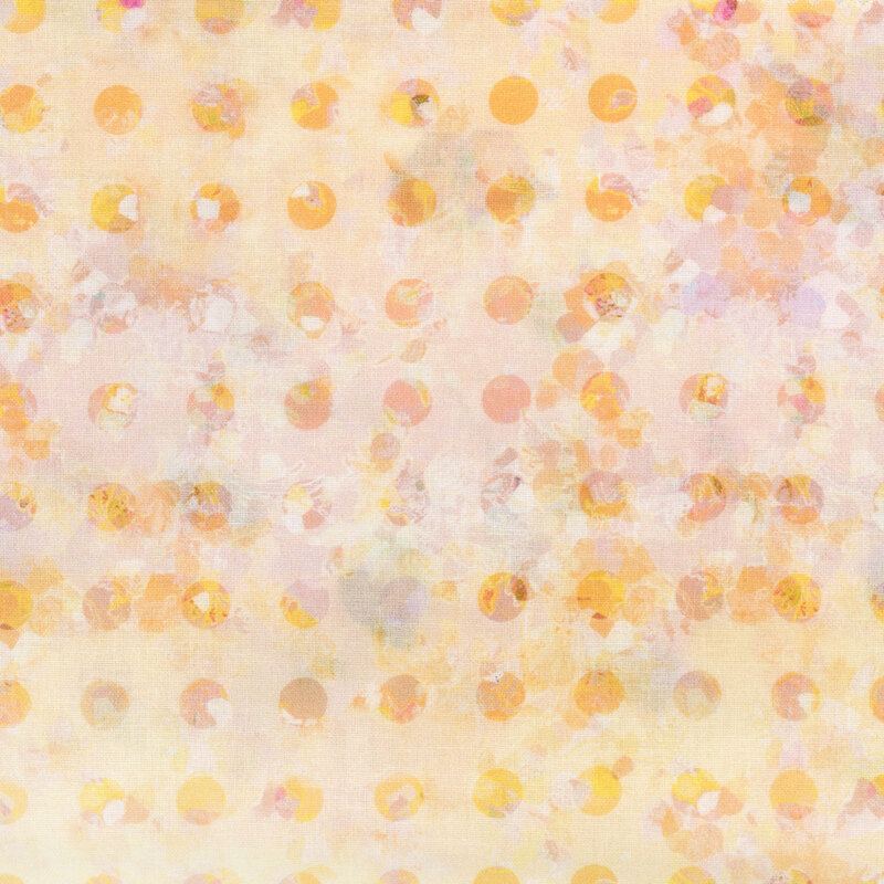 fabric featuring a kaleidoscope pattern of bright yellow and peach polka dots on a soft golden yellow background.