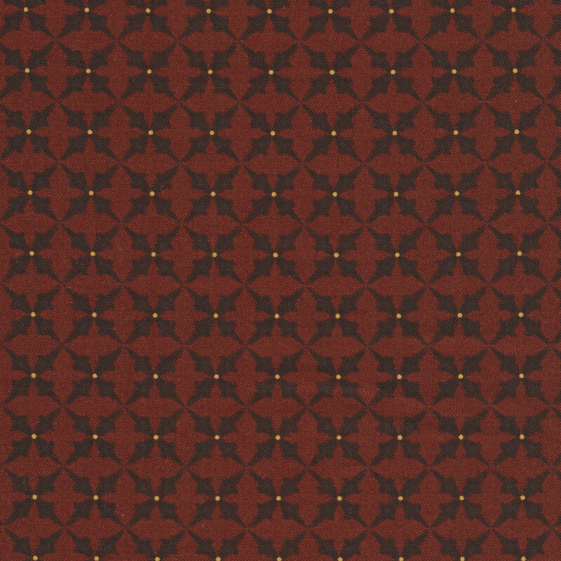Dark red fabric with black trumpet-flower designs and small yellow spots