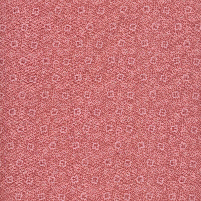 fabric featuring lovely small floral motifs and leaves surrounded by dots in tonal antique pink