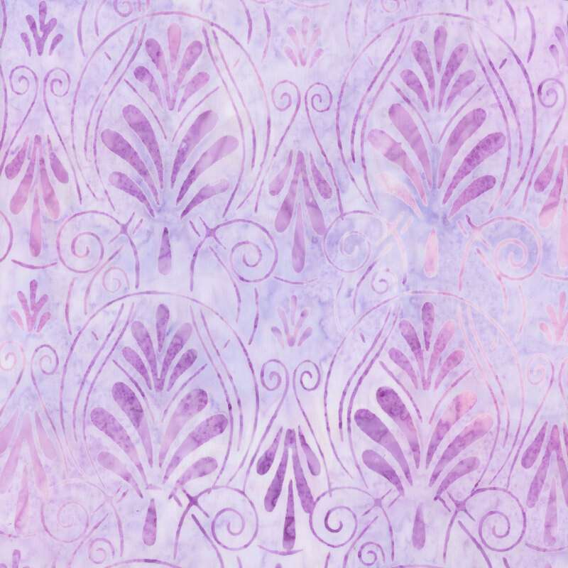 fabric featuring damask motifs of swirls and scrolls with a lovely mottled light purple color.