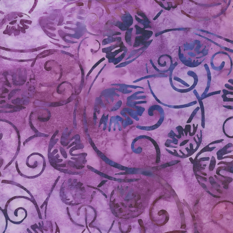 fabric featuring swirls of vining flowers with vibrant mottled indigo and purple colors.