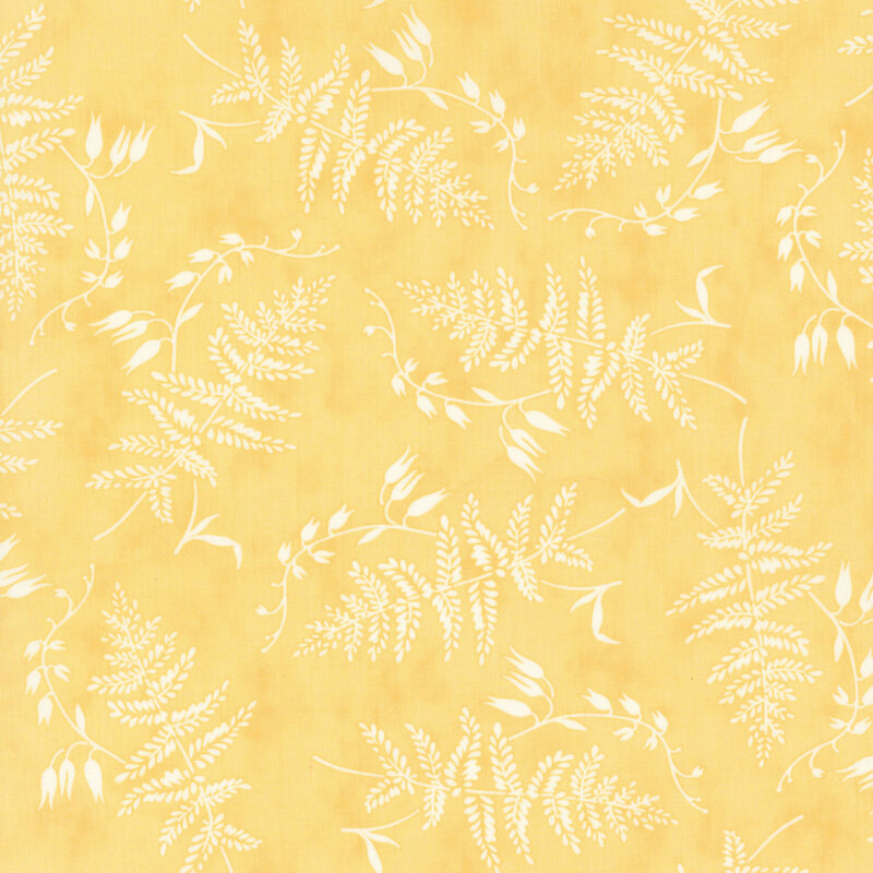 pastel yellow fabric featuring strewn white ferns and foliage
