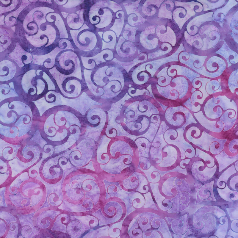 fabric featuring purple and magenta swirls on a light pastel purple mottled background.