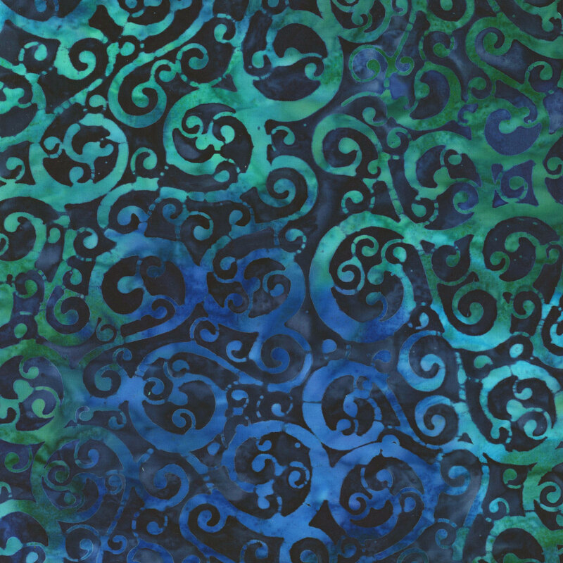 fabric featuring dark blue and green swirls on a mottled dark blue background.