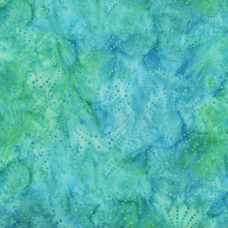 fabric featuring a light dotted fan print on a light blue and bright green mottled background.