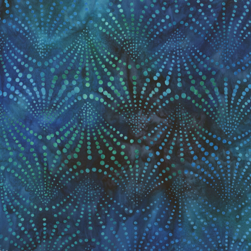 Fabric featuring an emerald green and blue dotted fan print on a dark blue mottled background.