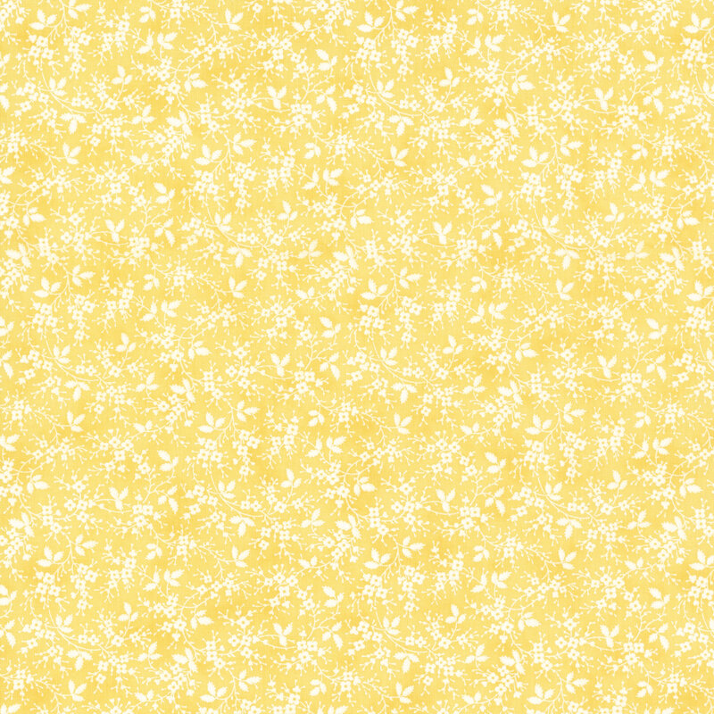 pastel yellow fabric featuring small white flowers on vines