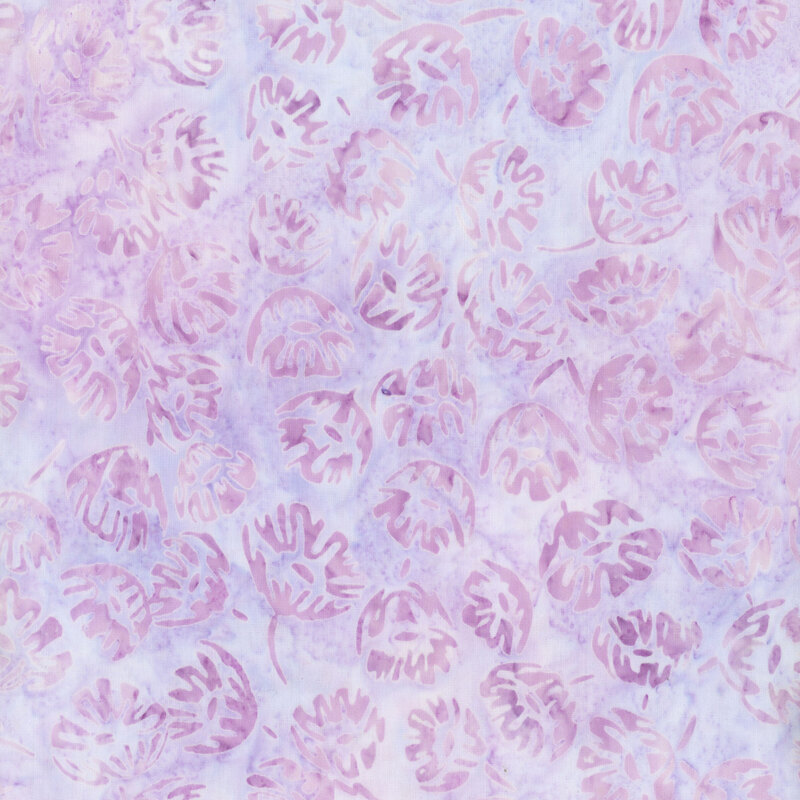 fabric featuring tossed purple mottled flowers on a light pastel purple mottled background.